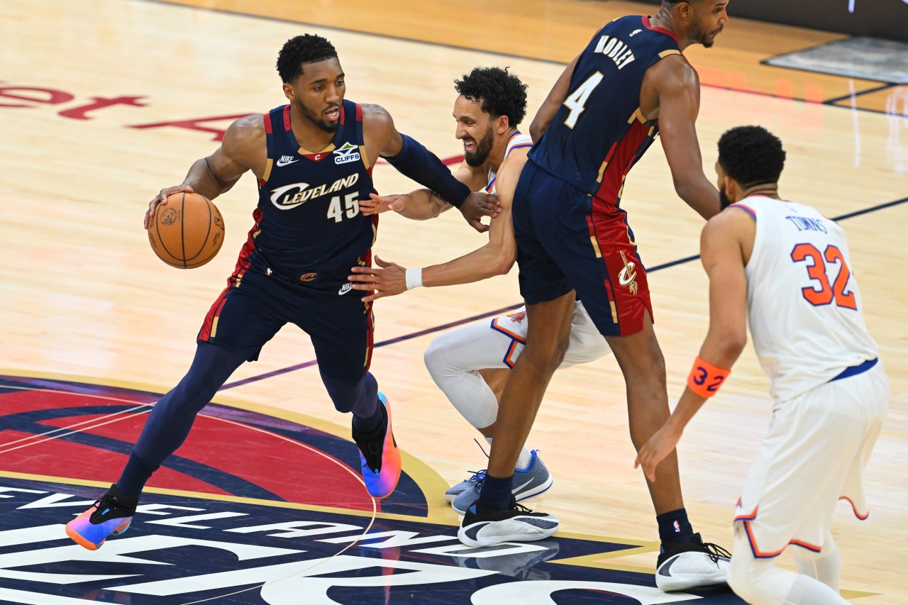Donovan Mitchell #45 of the Cleveland Cavaliers dribbles past a New York Knicks defender during an NBA playoff game at Rocket Arena.