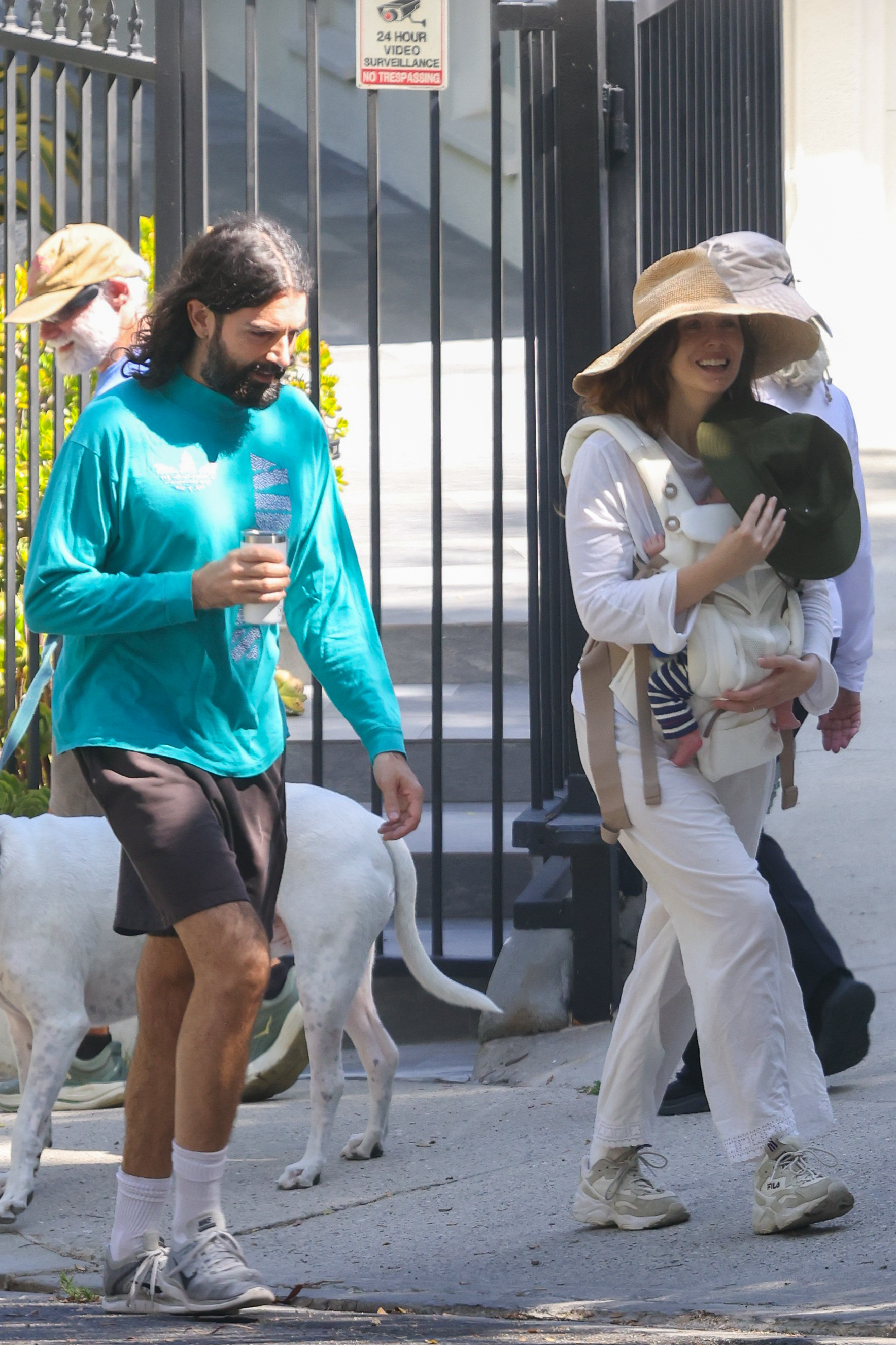 Elizabeth Olsen and Robbie Arnett walking in Los Angeles with their newborn baby