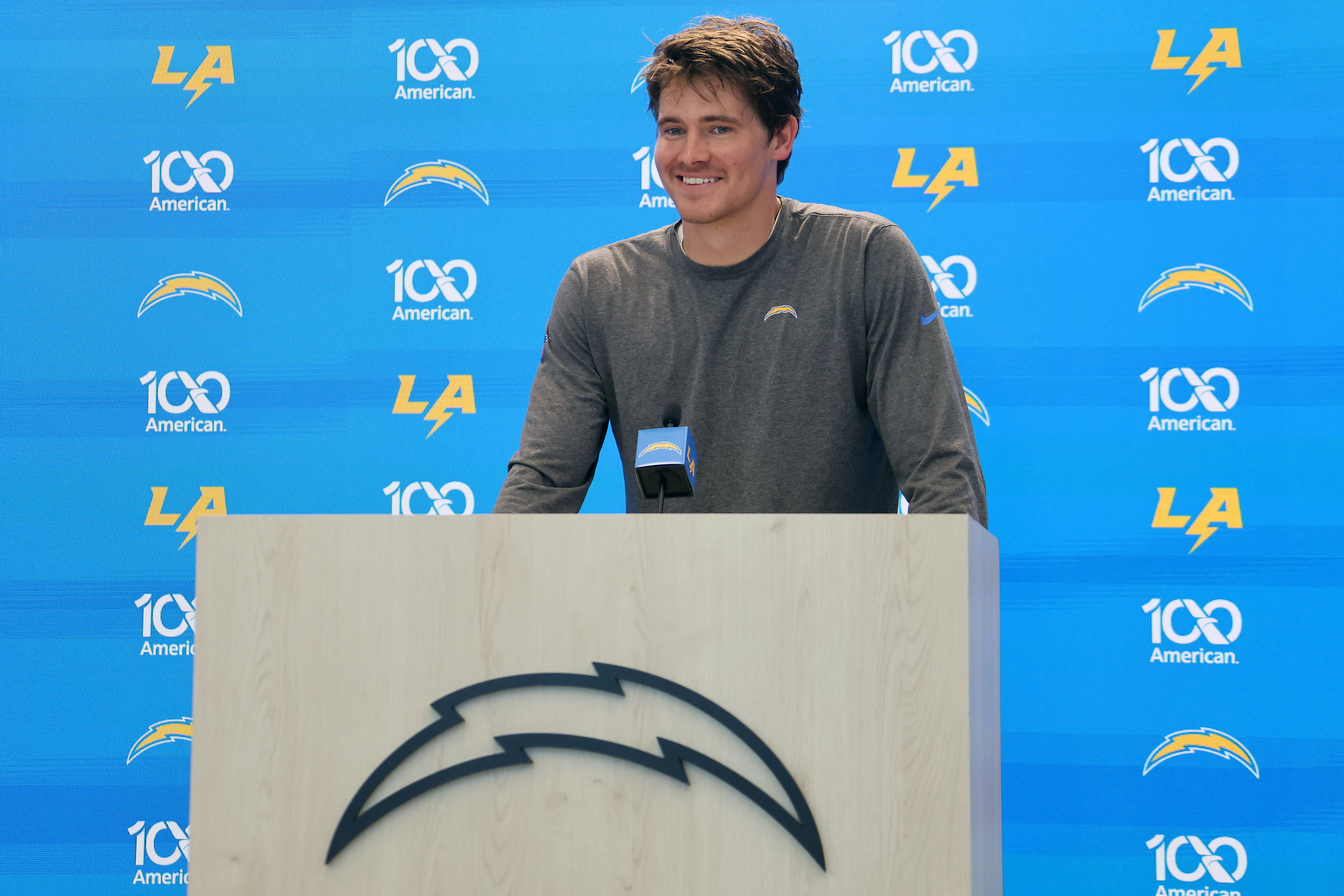 Justin Herbert smiling at a press conference during Los Angeles Chargers Training Camp in El Segundo, California