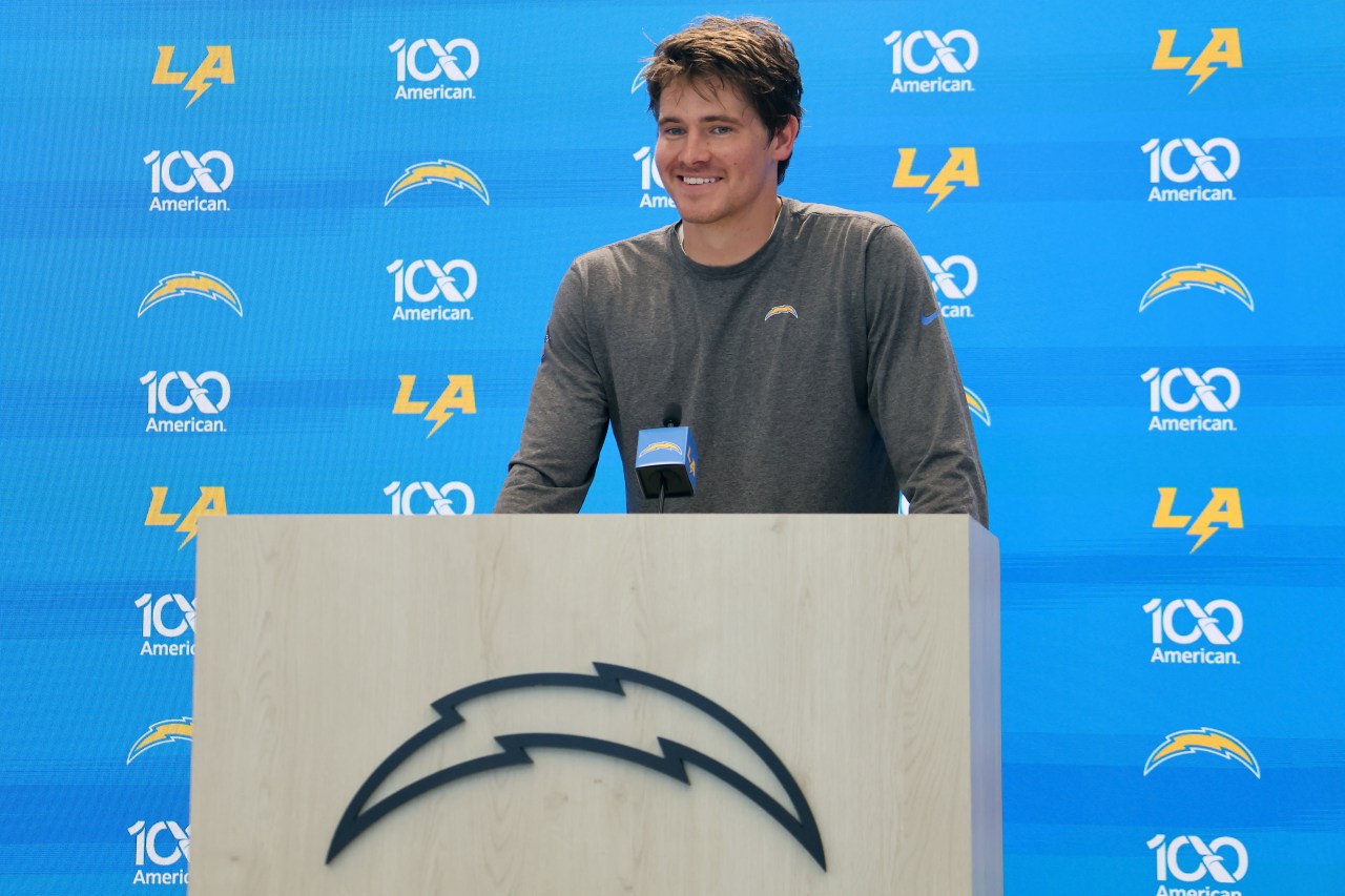Justin Herbert smiling at a press conference during Los Angeles Chargers Training Camp in El Segundo, California