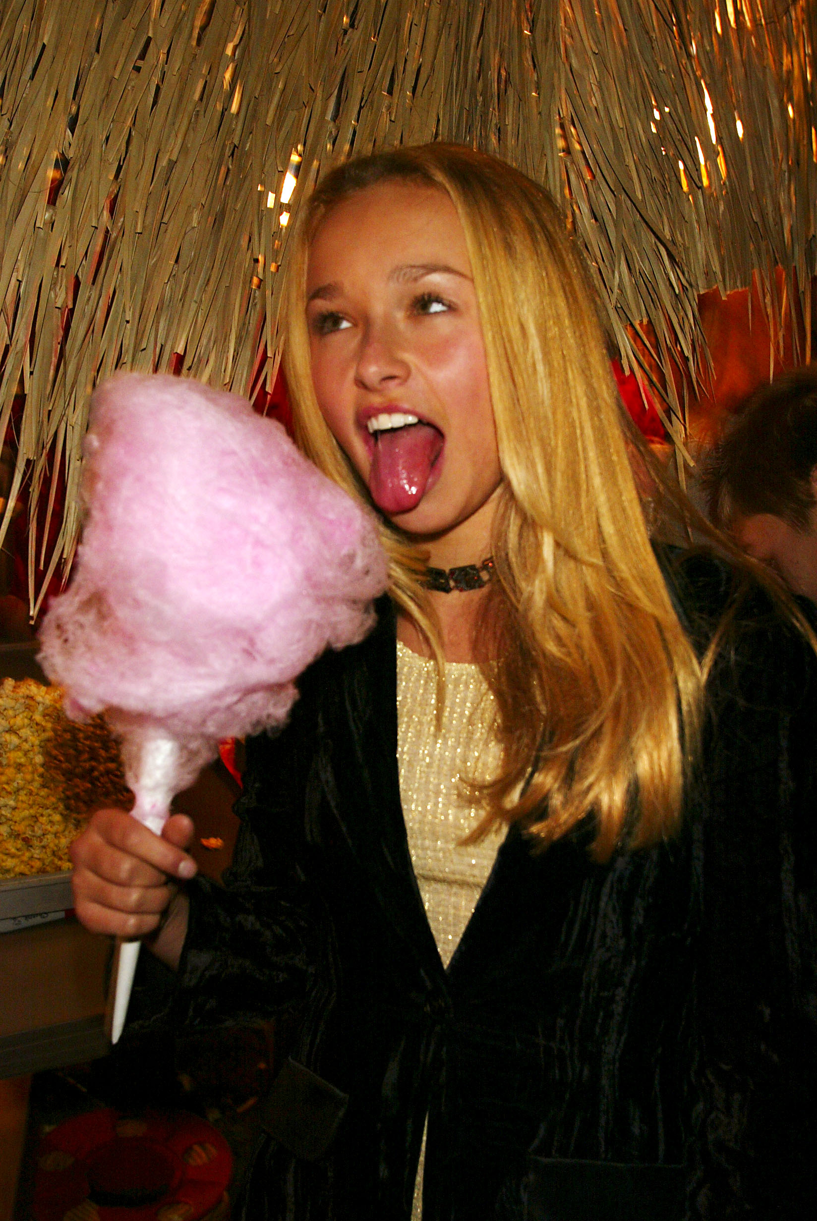 Young Hayden Panettiere eating cotton candy at a DVD launch event in New York City in 2002