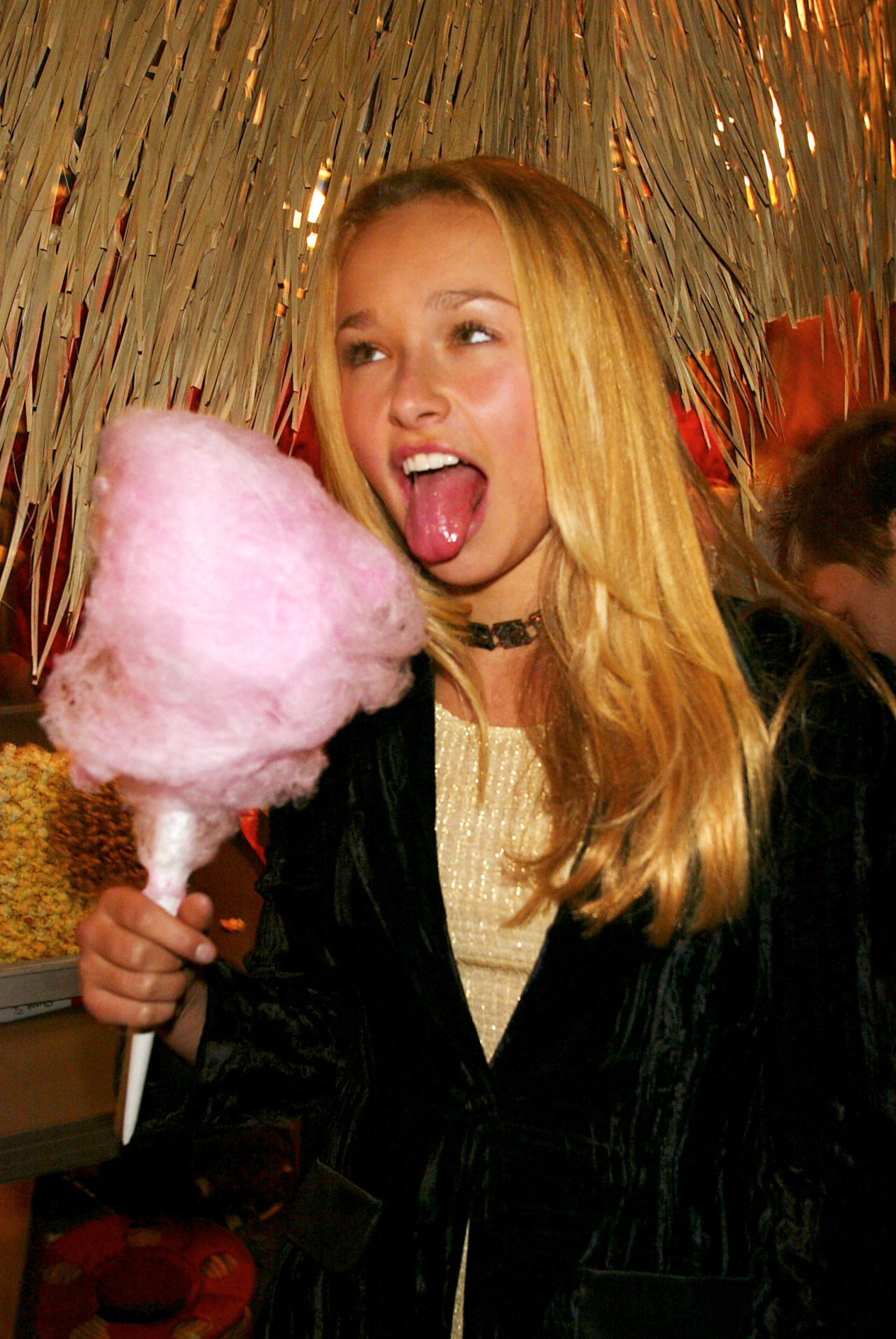 Young Hayden Panettiere eating cotton candy at a DVD launch event in New York City in 2002