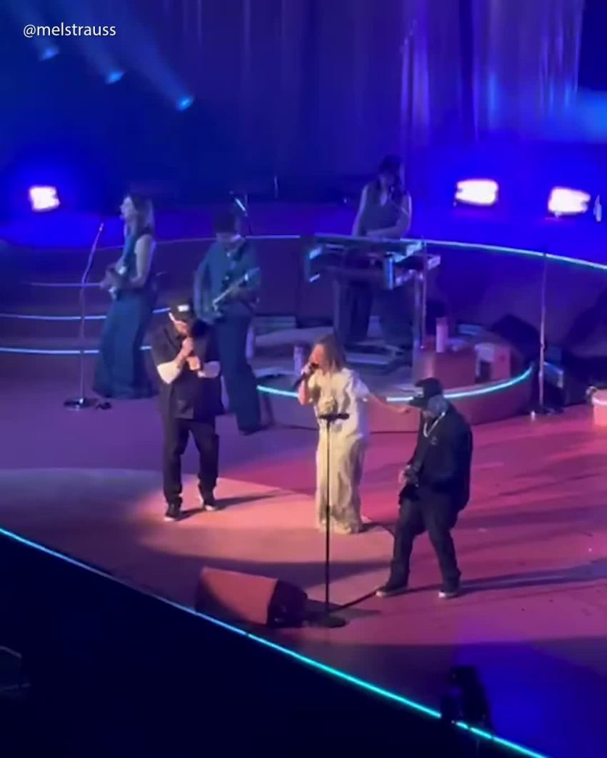 Hilary Duff and Joel Madden performing together onstage