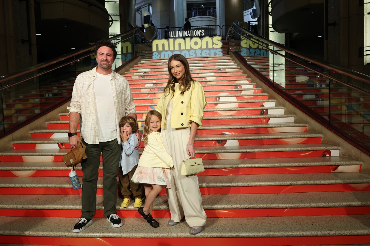 Beau Clark and Stassi Schroeder Clark posing together at the Minions & Monsters premiere at Dolby Theatre in Hollywood