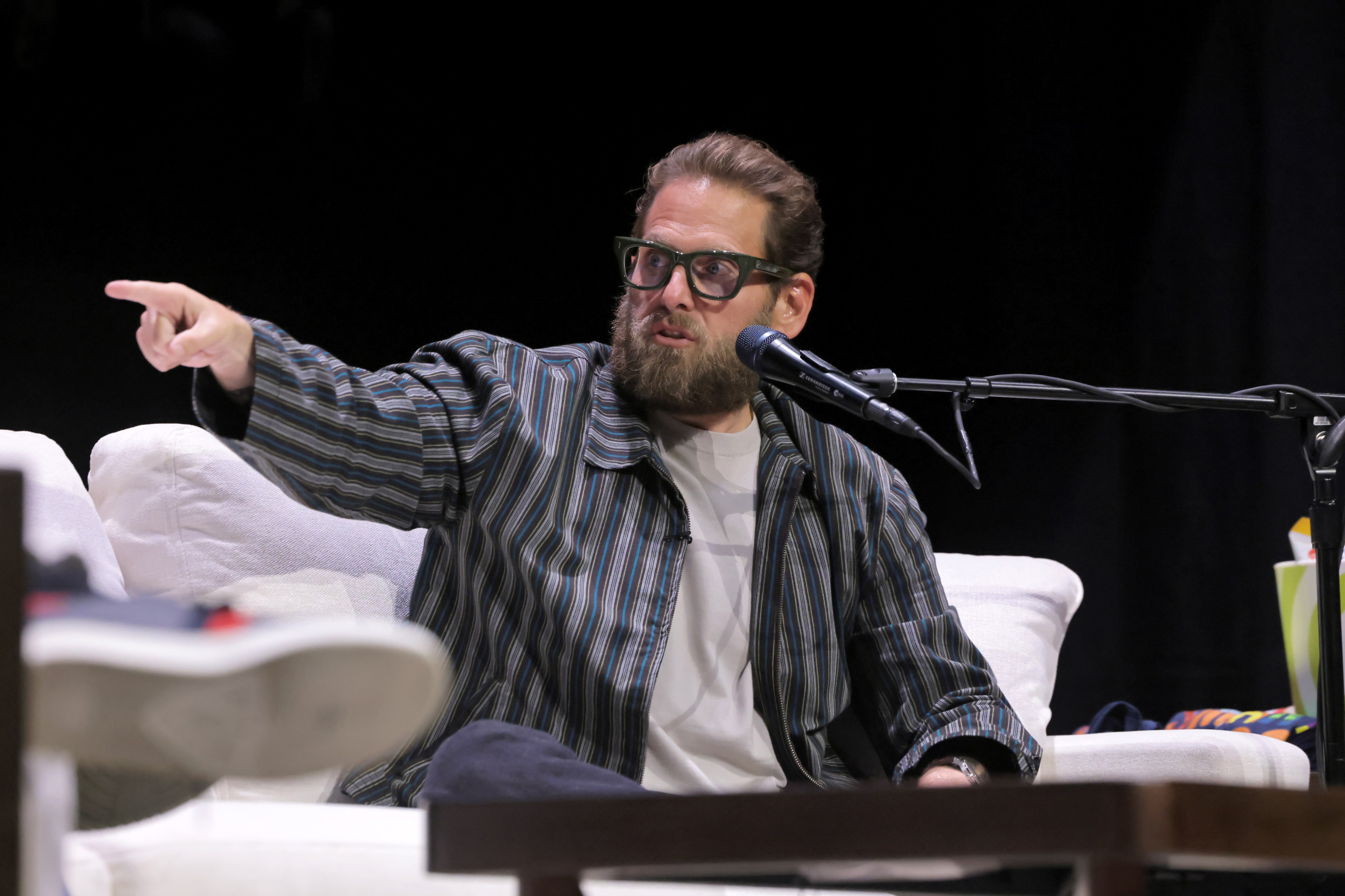 Jonah Hill speaking onstage at the SiriusXM SmartLess LIVE event at Avalon Hollywood