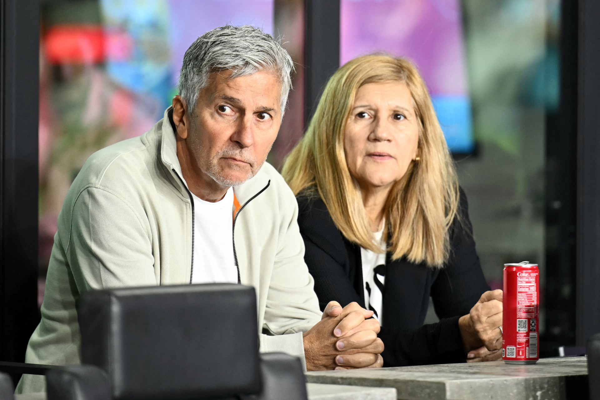 Jorge Messi and Celia Cuccittini seated in the stands at Chase Stadium before an Inter Miami MLS playoff match