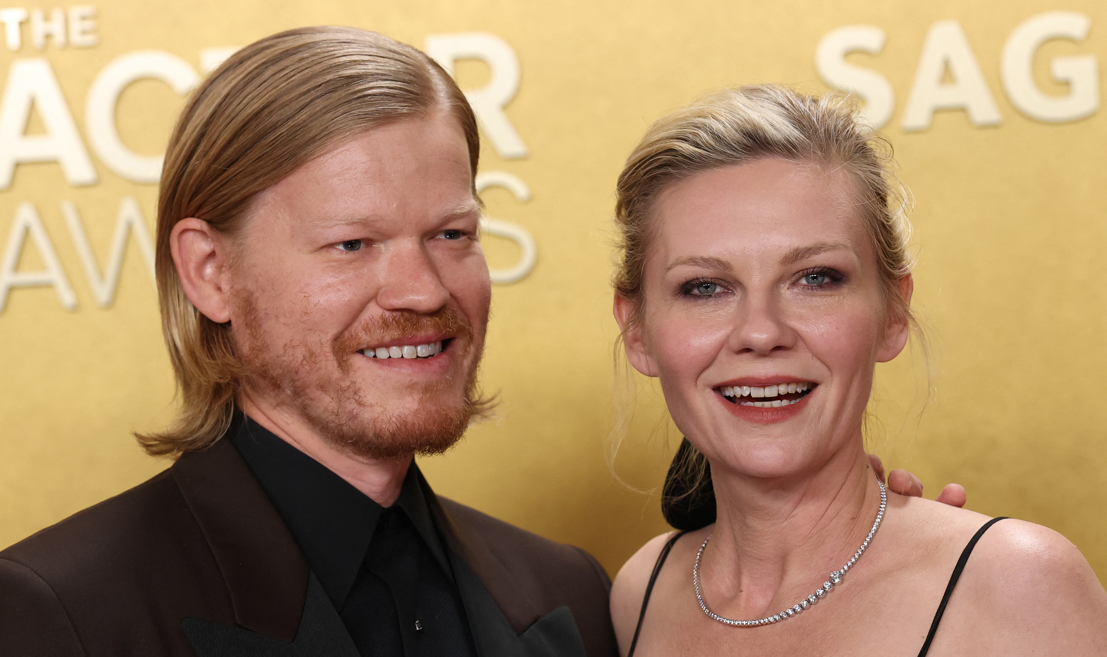 Jesse Plemons and Kirsten Dunst on the red carpet at the 32nd Annual Actor Awards at the Shrine Auditorium in Los Angeles