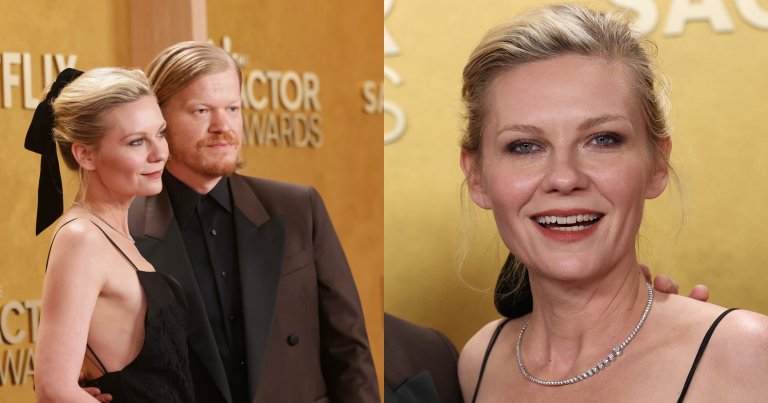 Kirsten Dunst in a black dress with a black bow in her hair stands alongside Jesse Plemons in a dark suit at the SAG Awards red carpet.