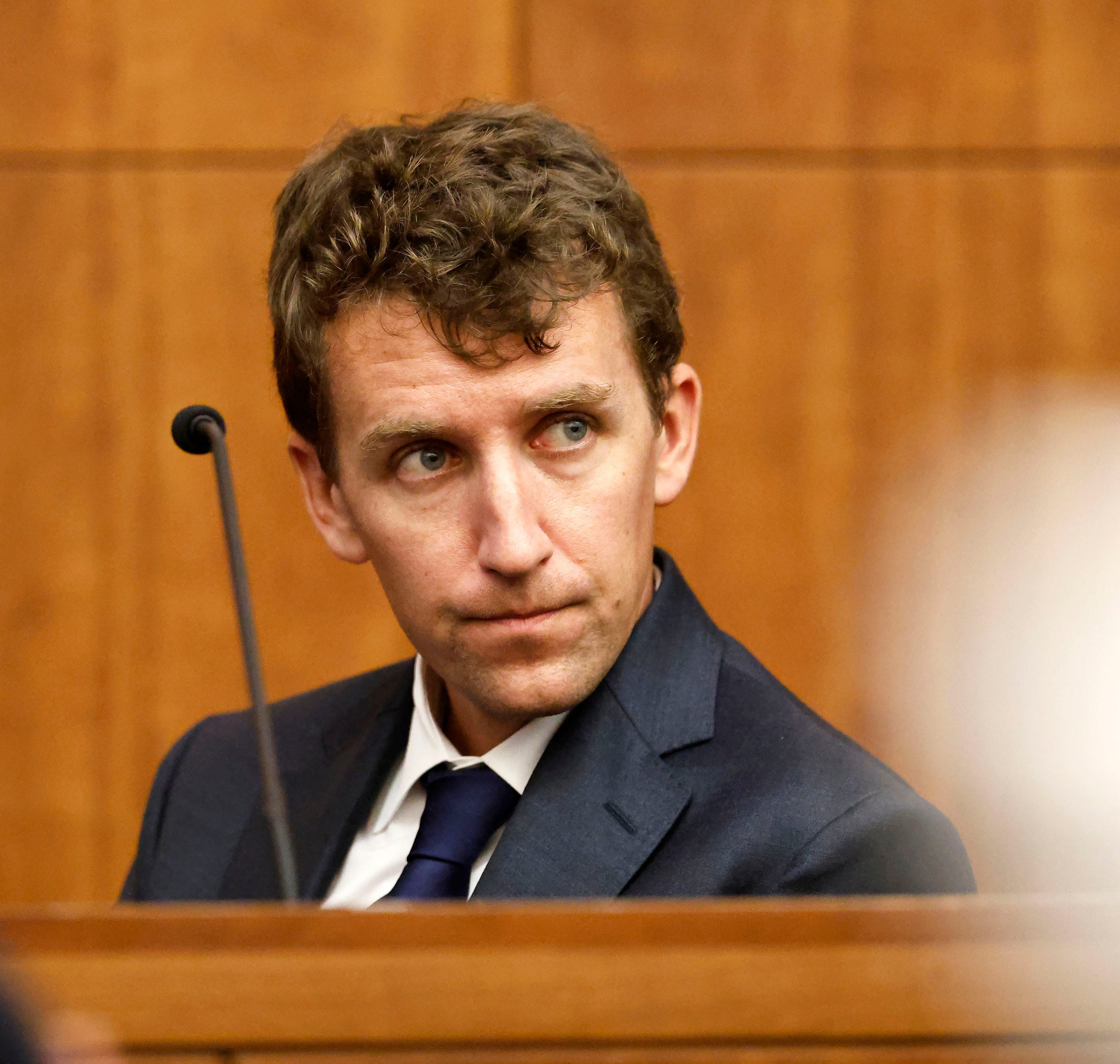 Patrick Clancy looks toward the defense table where Lindsay Clancy is seated before testifying at her murder trial in Plymouth Superior Court