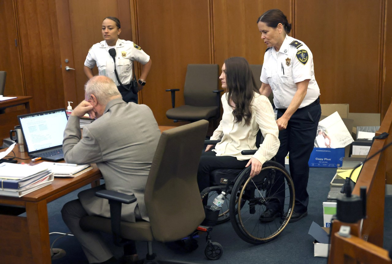 Lindsay Clancy walking into the courtroom alongside defense attorney Kevin Reddington at Plymouth Superior Court