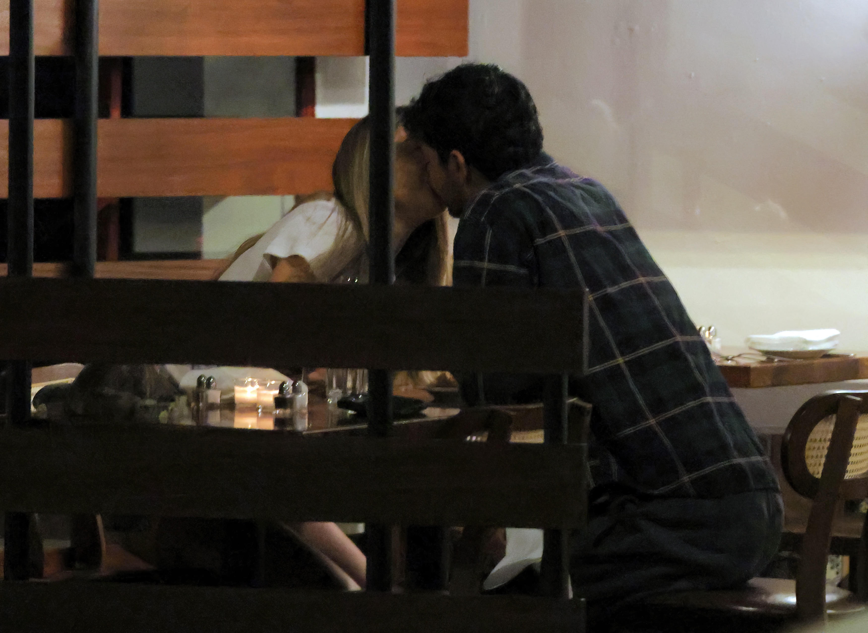 Madelyn Cline and Michael Reyes seated together at a restaurant table at El Cava in Studio City