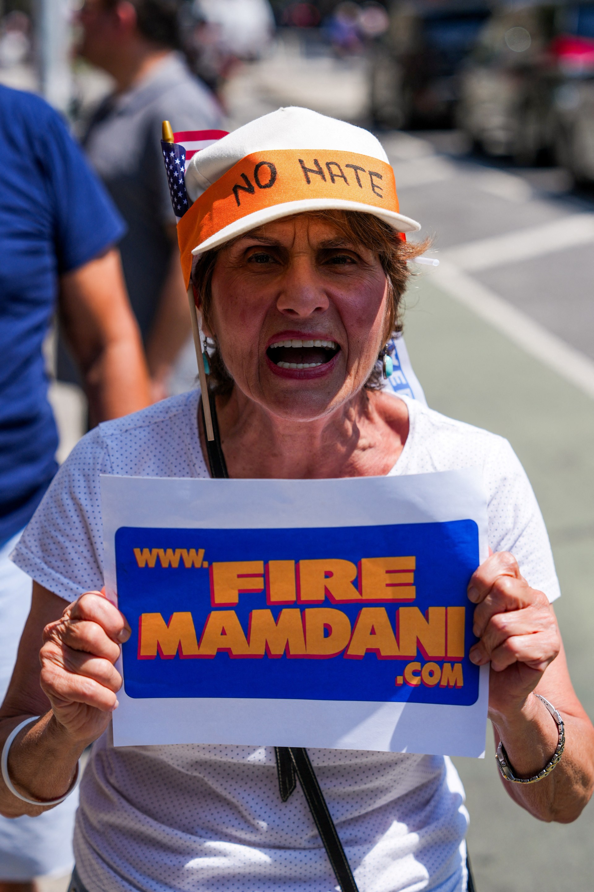 A person shouting at a rally in New York City opposing Mayor Zohran Mamdani