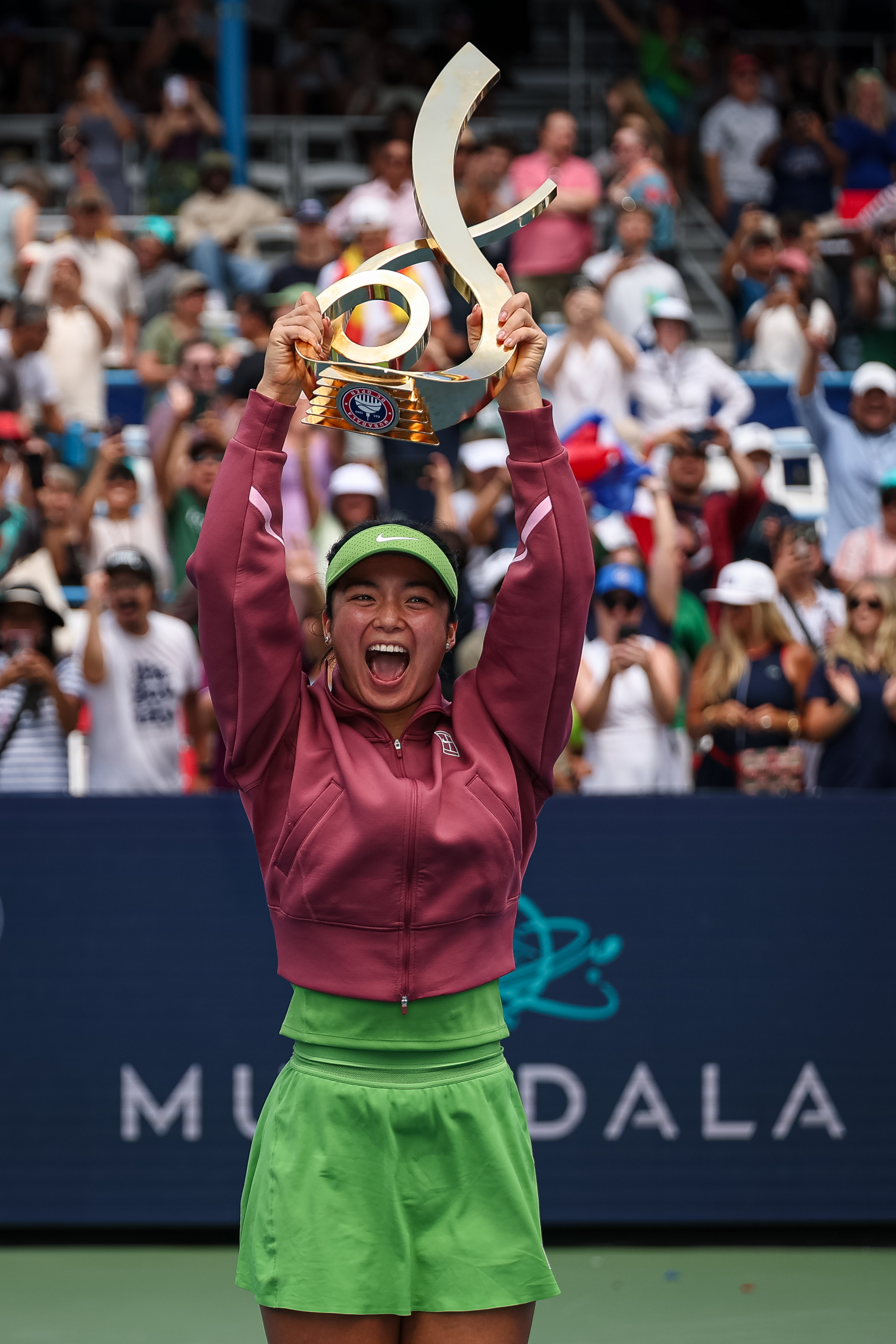 Alexandra Eala holding the Championship Trophy after winning the Mubadala DC Open 2026 women's singles title in Washington, DC