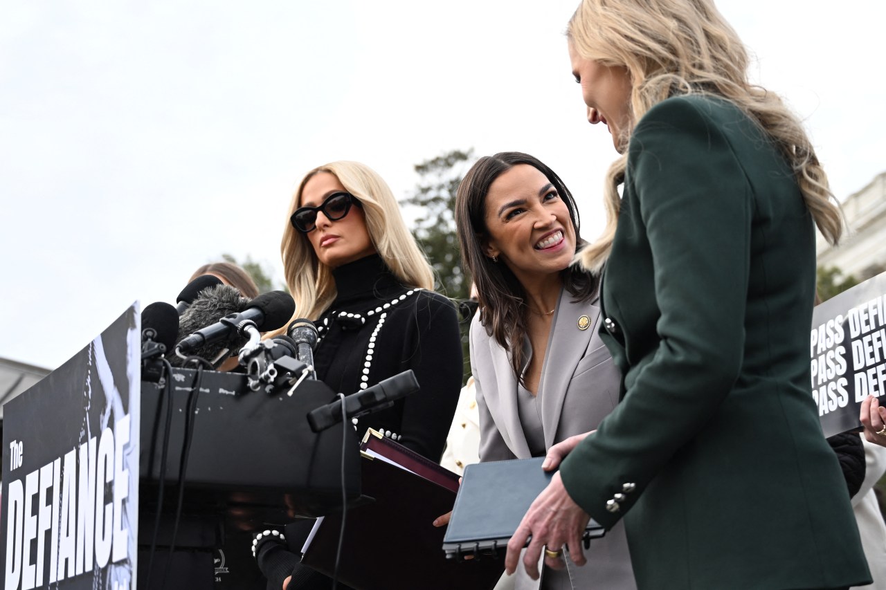 Paris Hilton, Rep. Alexandria Ocasio-Cortez, and Rep. Laurel Lee standing together on Capitol Hill in support of the DEFIANCE Act
