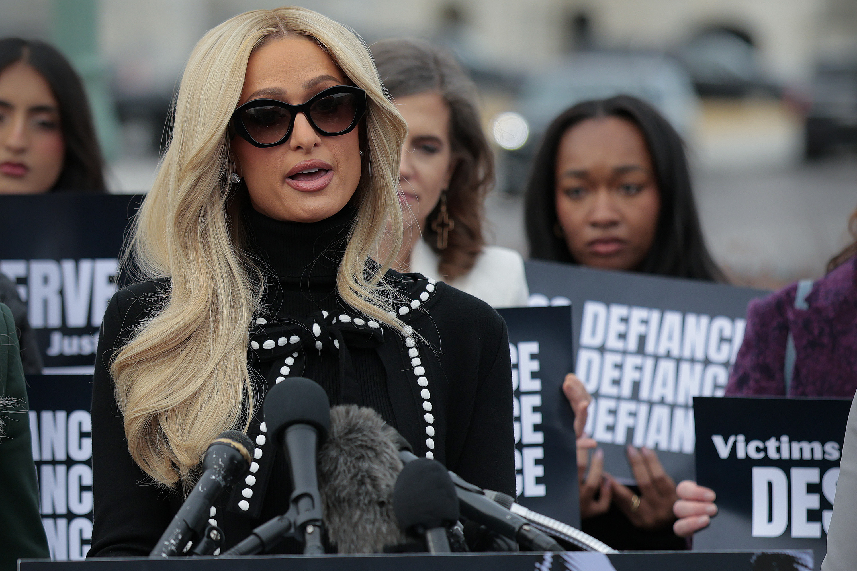 Paris Hilton speaking at a press conference at the U.S. Capitol in support of the DEFIANCE Act