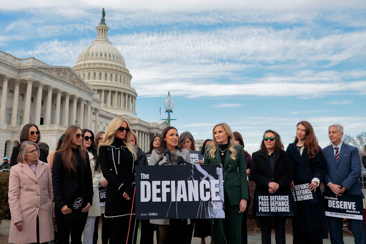 Paris Hilton, Rep. Alexandria Ocasio-Cortez, and Rep. Laurel Lee speaking together at the U.S. Capitol in support of the DEFIANCE Act