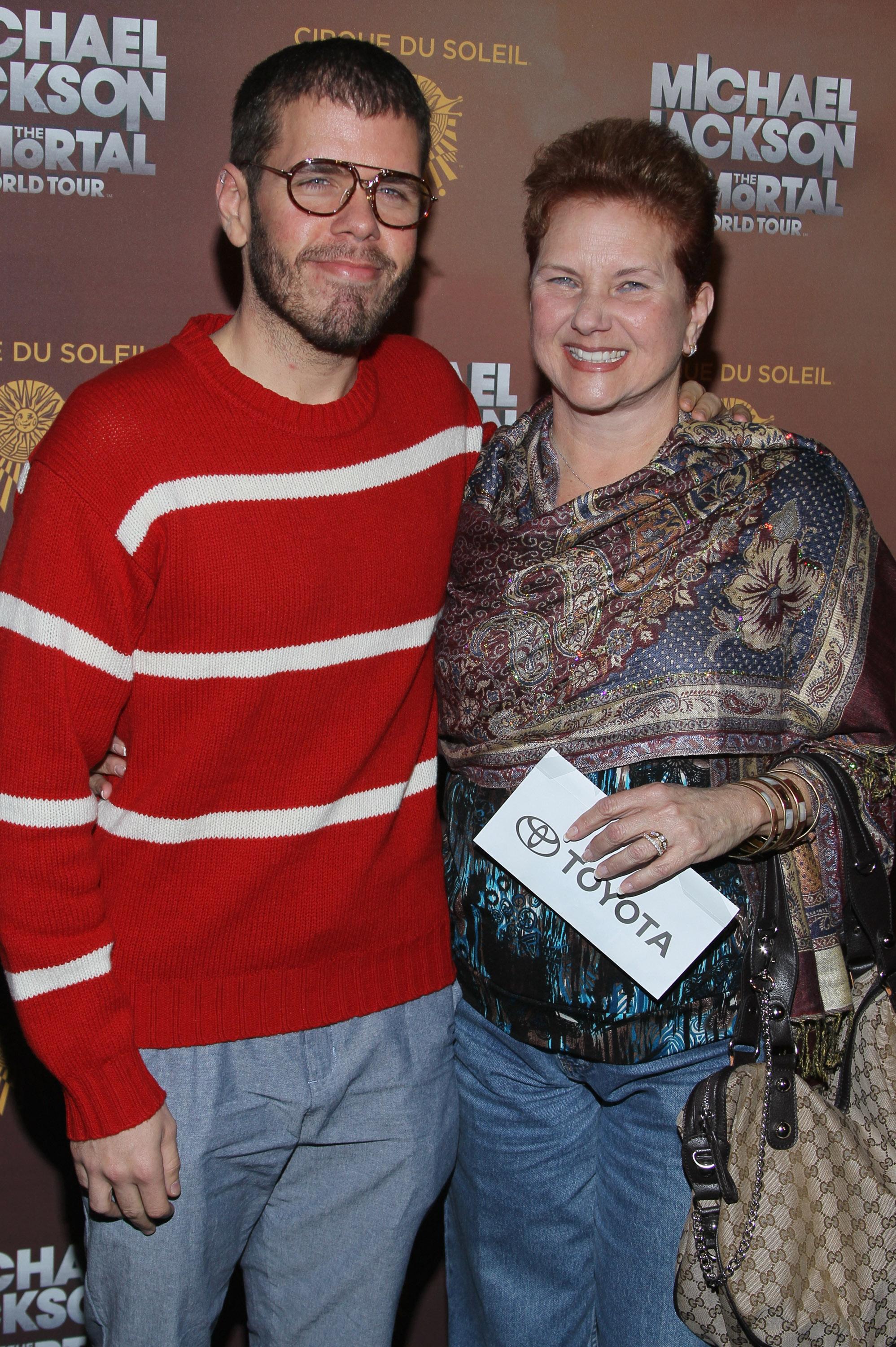 Perez Hilton and his mom at the Michael Jackson THE IMMORTAL World Tour premiere at Staples Center in Los Angeles