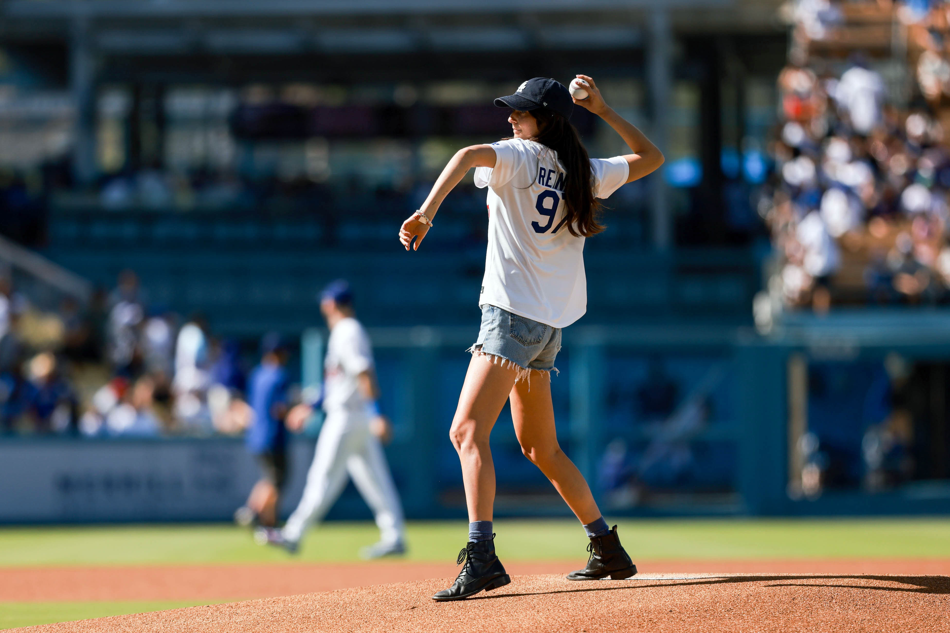 Romy Reiner throwing a ceremonial first pitch on the field at Dodger Stadium