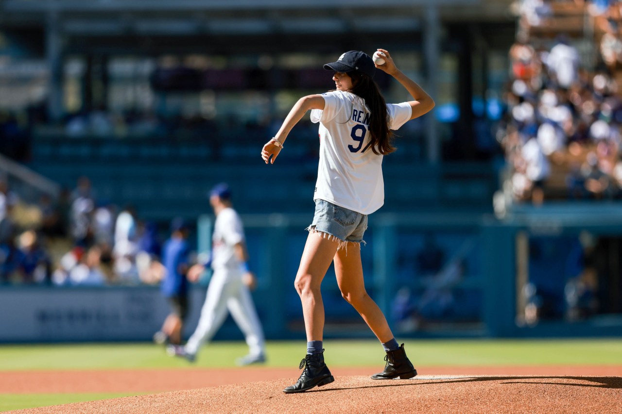 Romy Reiner throwing a ceremonial first pitch on the field at Dodger Stadium