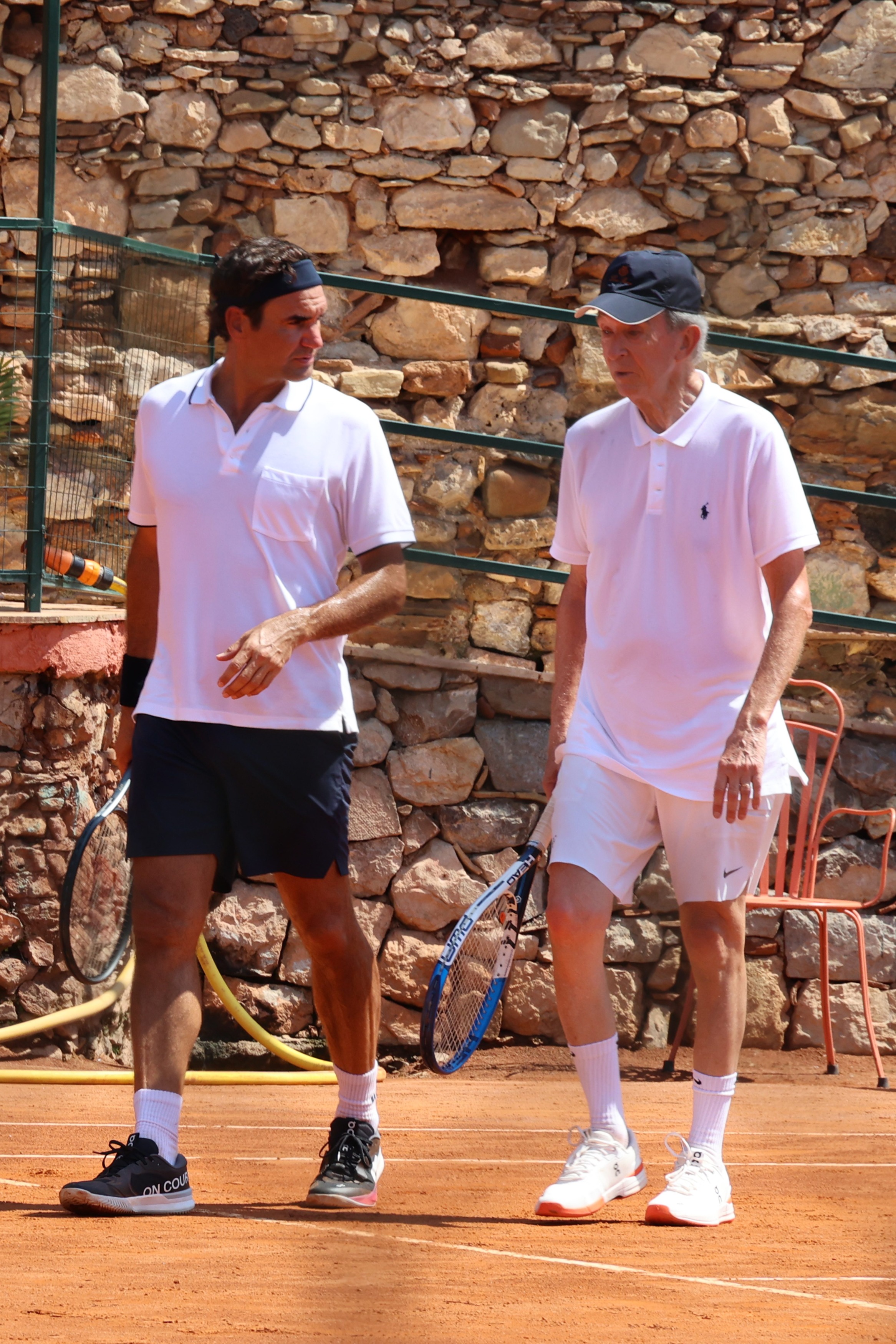 Roger Federer and Bernard Arnault playing doubles tennis together in Taormina, Sicily