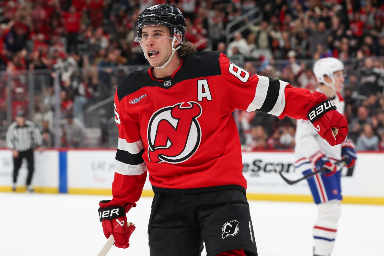 Jack Hughes of the New Jersey Devils celebrating a goal against the Montreal Canadiens at Prudential Center