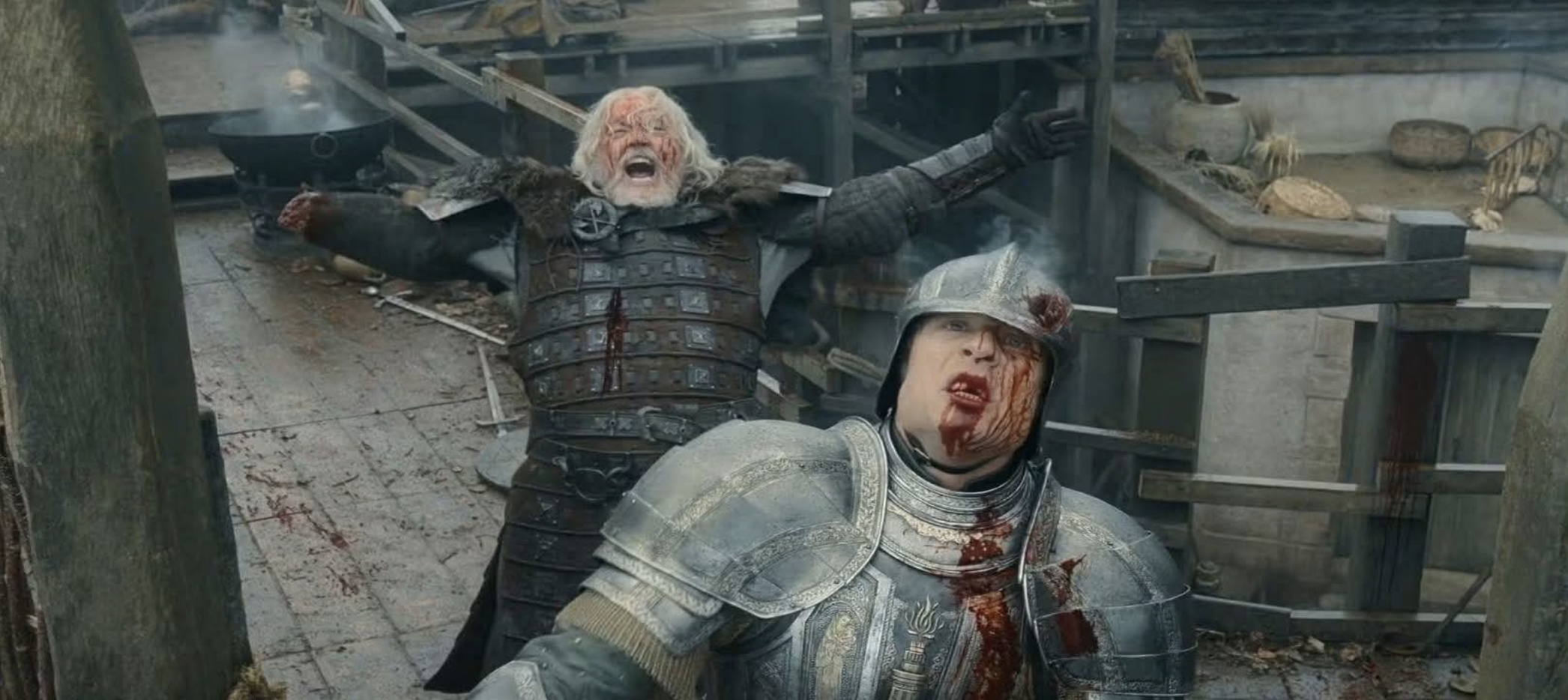 Wounded silver-haired warrior in dark armor spreads his arms defiantly while a blood-soaked knight in silver armor struggles before him on a battle-worn deck.
