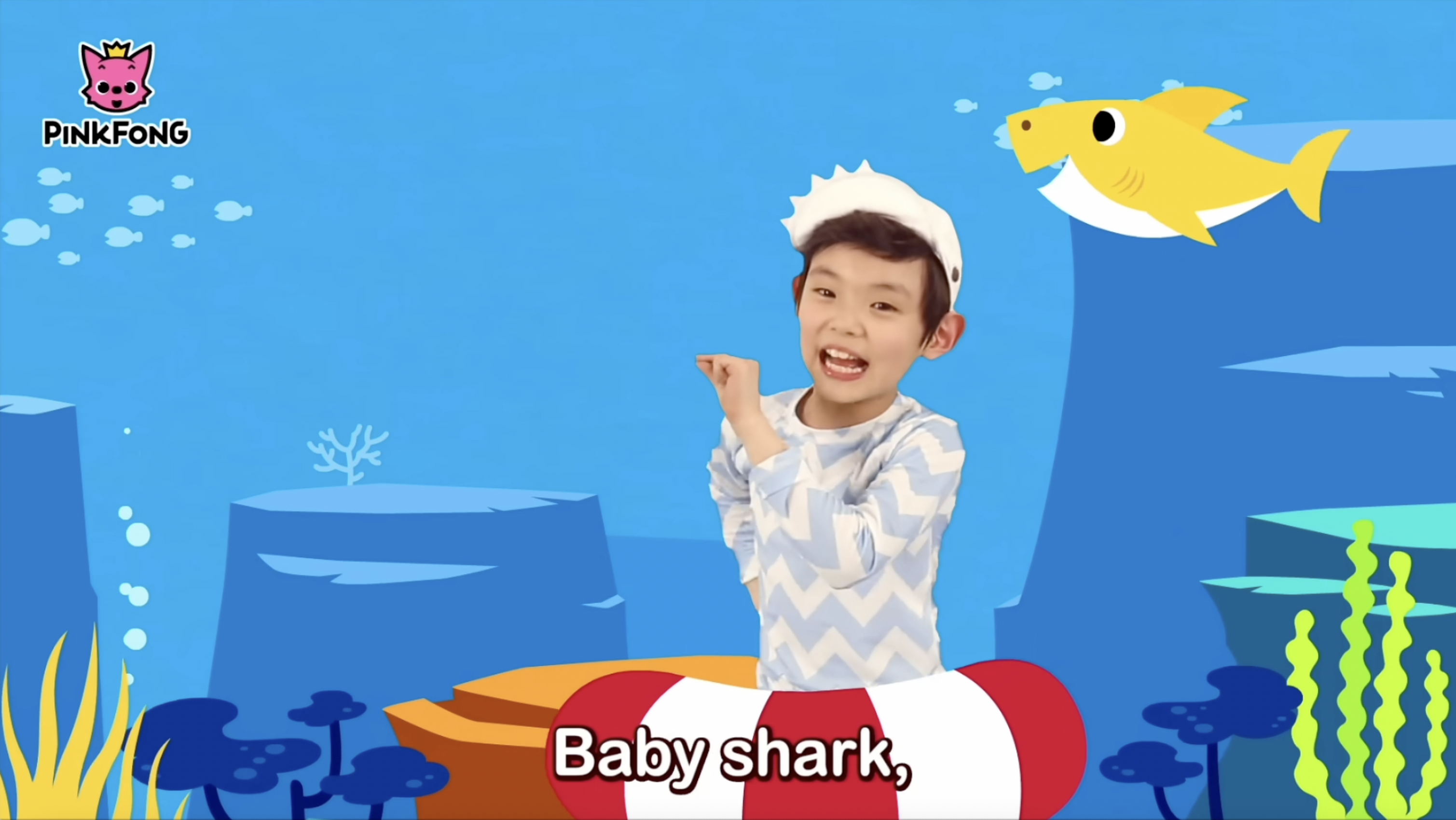 Baby Shark music video still featuring colorful cartoon sharks