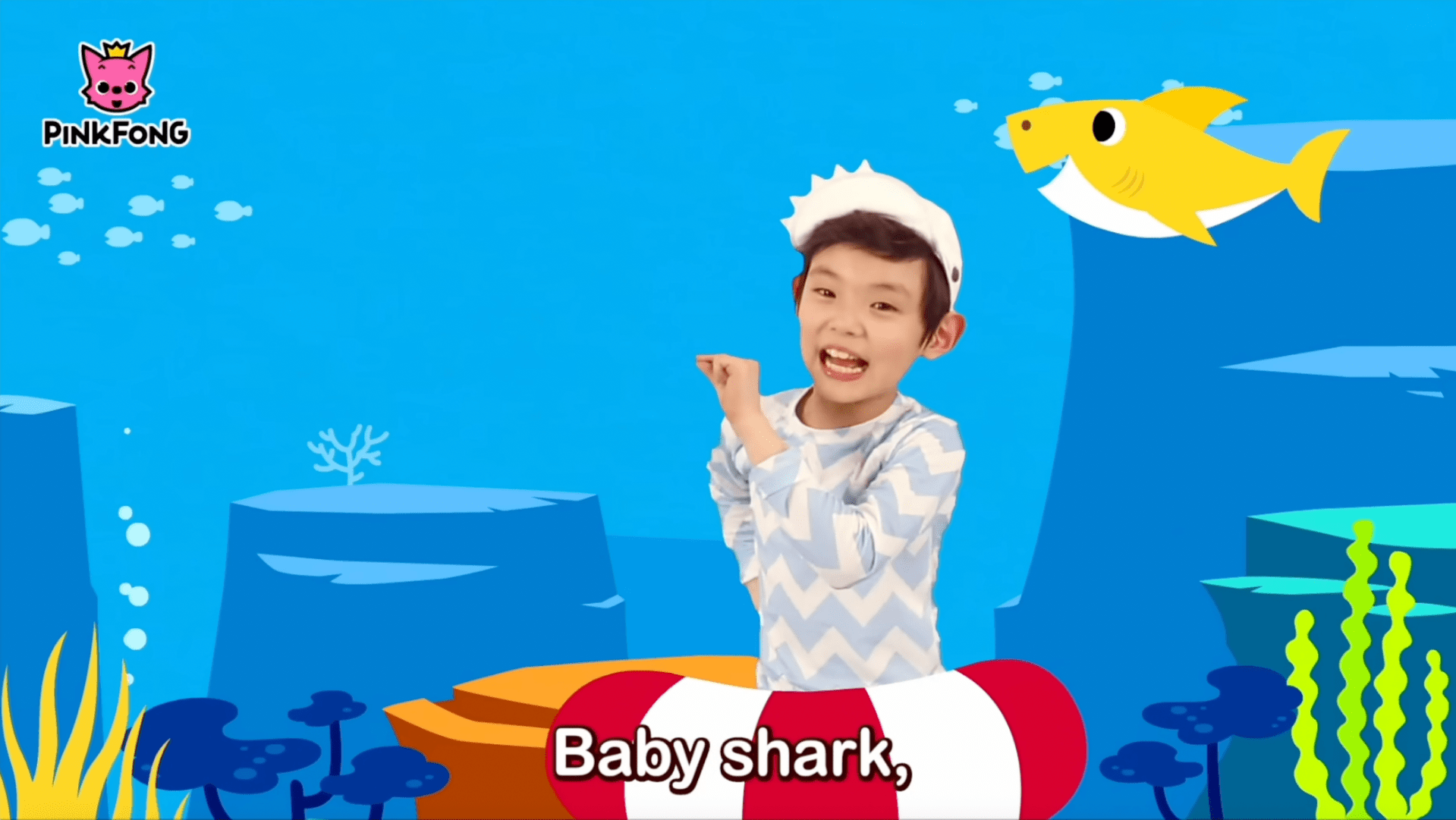 Baby Shark music video still featuring colorful cartoon sharks