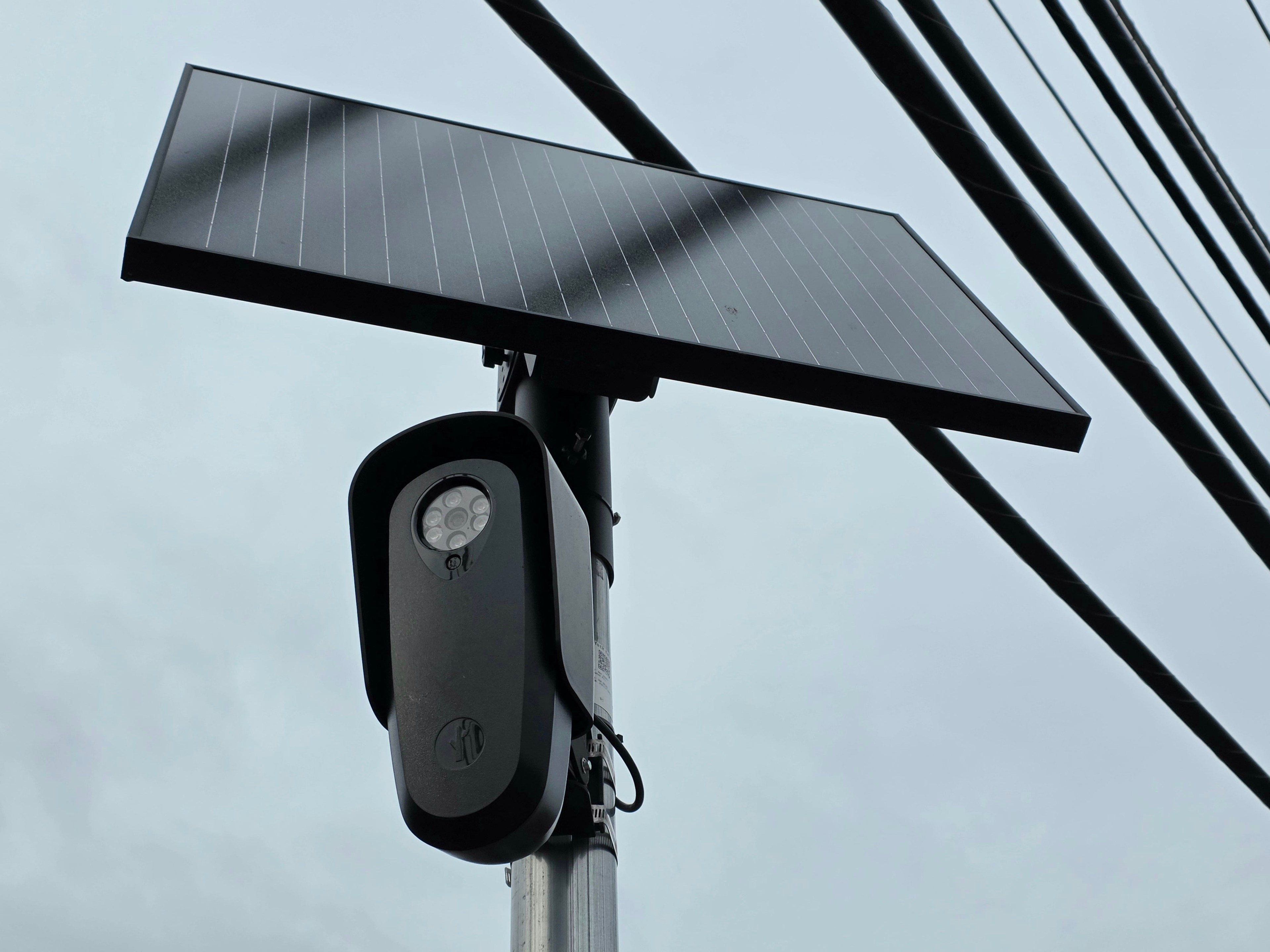 A Flock Safety license-plate reading camera mounted on a pole along State Road in Rehoboth Beach