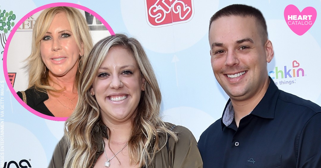 Vicki Gunvalson in a black long-sleeve mini dress posing on the red carpet at the WE tv Love Blows premiere event.