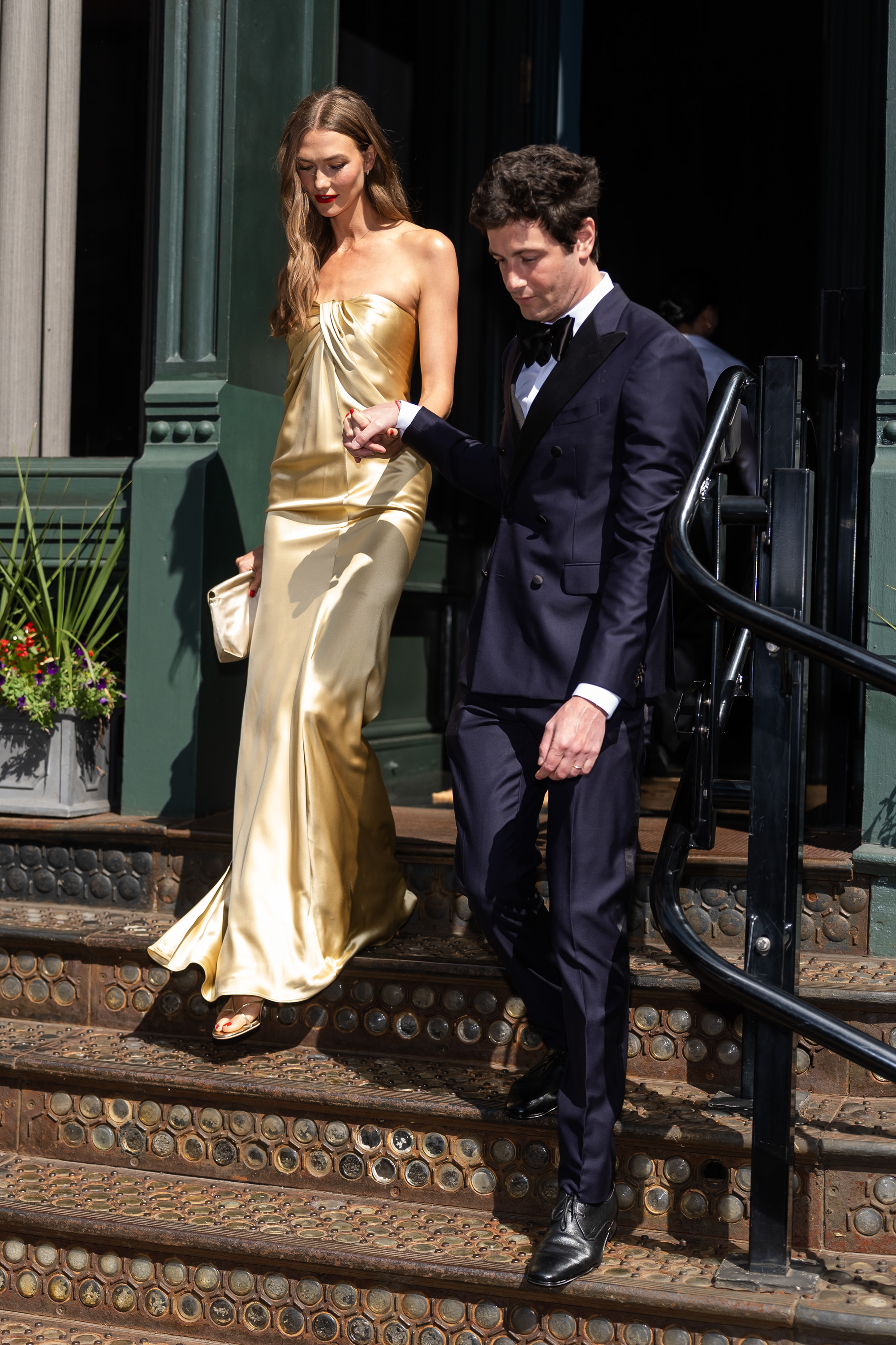 Karlie Kloss and Joshua Kushner walking together in SoHo, New York City